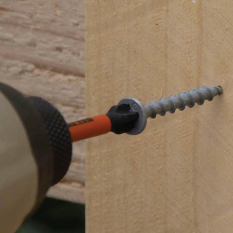 Ball End Hex Bit Set 20 Piece For Impact Drivers 2 Inch installation into wood showing bit holder in use
