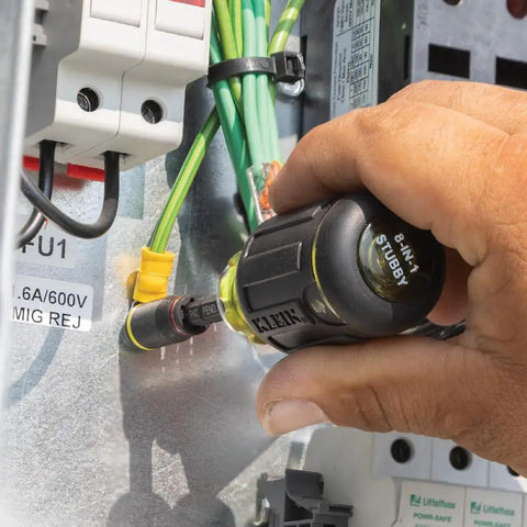 Three In One Flip Socket For Impact Drivers With One Quarter Inch Quick Connect And Five Sixteenth Inch Hex Drivers Deep And Shallow Positions SAE Socket And Bit Holder Rare Earth Magnet Three Inch Length Impact Rated being used in an electrical panel setup