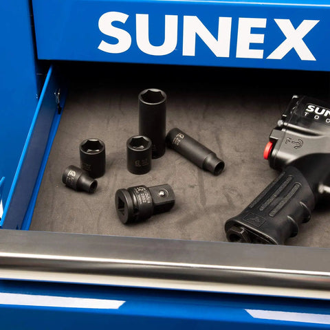 Impact Socket Adapter Beefy Half Inch Drive Half Inch Female To Three Quarter Inch Male With CrMo Steel Ball Detent Tapered Square End For Quick Alignment And High Torque Meets ANSI Standards Sunex Tools in a tool drawer with impact wrench.