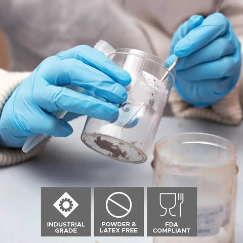 Person using DuraSkin Nitrile Gloves 3.5 Mil Large Powder Free Micro Textured Blue Industrial for handling chemicals.