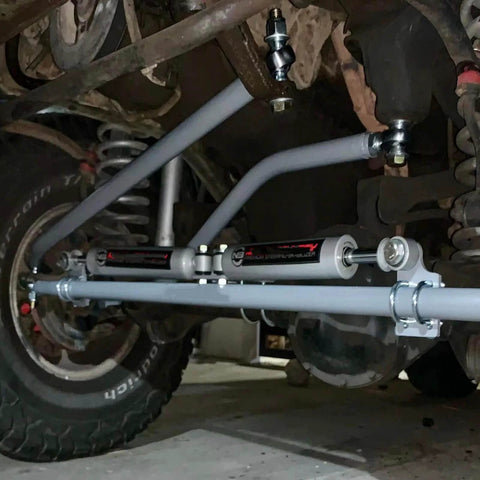 1.25 inch Heim joint rod end kit with tube adapters, installed on vehicle suspension, showcasing left and right hand thread chromoly joints