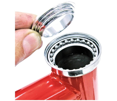 Installing Beefy Premium One And One Eighth Inch Headset Bearings Kit into bike frame, showcasing ball bearings and retainer