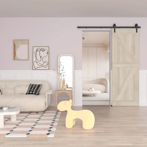 Living room with 5FT Barn Door Hardware Kit with Heavy Duty Modular Sliding Track installed on wooden barn door leading to cozy room