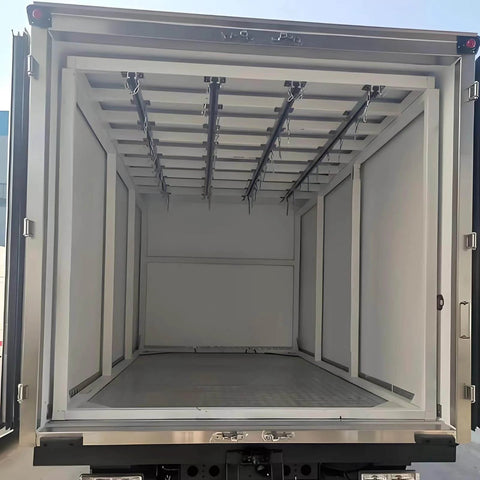 Rear view of an empty industrial container truck showing interior rails for heavy load transport and smooth silent sliding material handling.