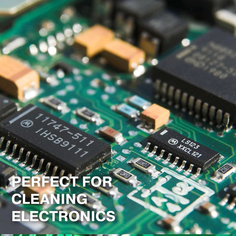 Close-up of electronic circuit board with text overlay "Perfect for Cleaning Electronics," highlighting use of Isopropyl Alcohol 99.9% Technical Grade, 32 Oz Bottles Four Pack, High Purity Cleaning Solvent For Labs And Electronics.