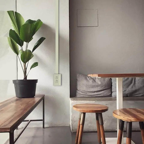 Living room with NM2-D Nonmetallic Plastic Raceway For Extending Power And Concealing Cords Outlet Kit installed on wall