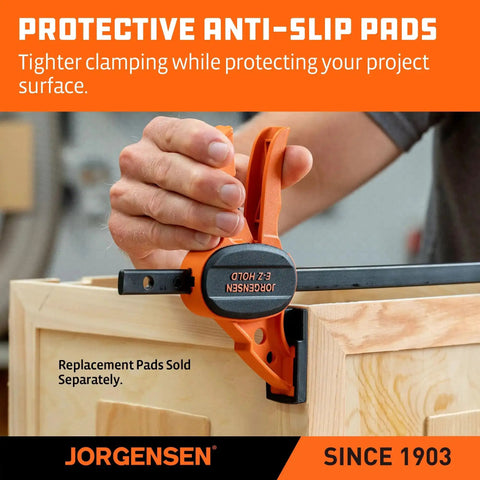 Hand using Six Inch Bar Clamps For Woodworking Four Pack With One Hand Light Duty EZ Hold Spreader Clamp 200 Lbs Capacity Jorgensen