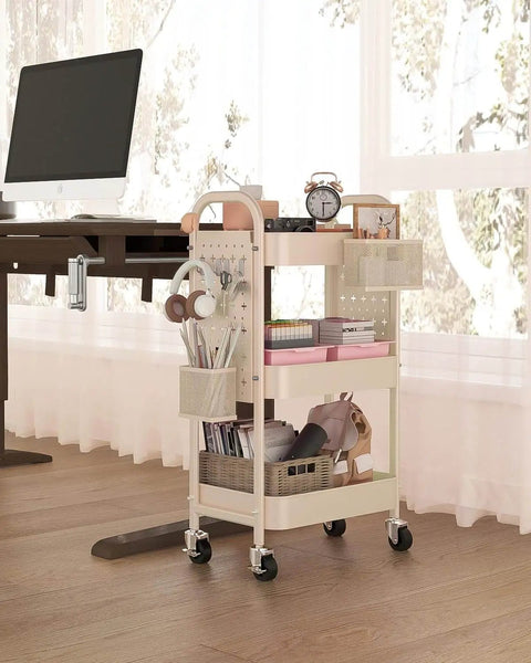 3 Tier Rolling Cart With DIY Pegboard Panels, Metal Utility Cart On Wheels Featuring Adjustable Front Or Side Pegboards, Includes 2 Hanging Baskets And 4 Hooks, Super Handy For Craft Room Kitchen Office Bathroom Organization In Khaki next to desk in office
