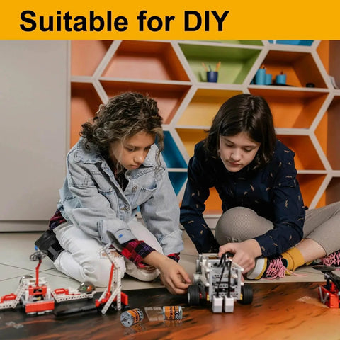 Children assembling DIY model toys with kits and tools in a colorful room, showcasing 6Pcs 280 Micro DC Motors 3V-12V 13500RPM 0.5A's application.