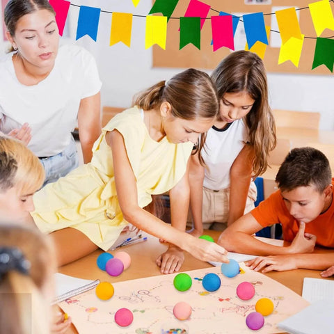 Kids using 60Pcs Table Tennis Balls, 40mm Plastic Ping Pong Ball for Party, DIY Arts, Multi Colored, Less Bounce, in a classroom activity