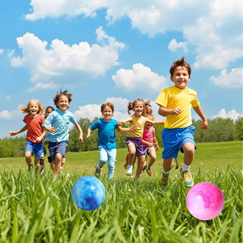 Children playing with 2PCS Inflatable Playground Balls, 8.7 Inch Marbleized Bouncy Balls Rubber Kickballs in a grassy field