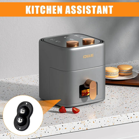 Grey kitchen appliance with toast slot on counter, orange accents, "KITCHEN ASSISTANT" text, black caster wheel inset