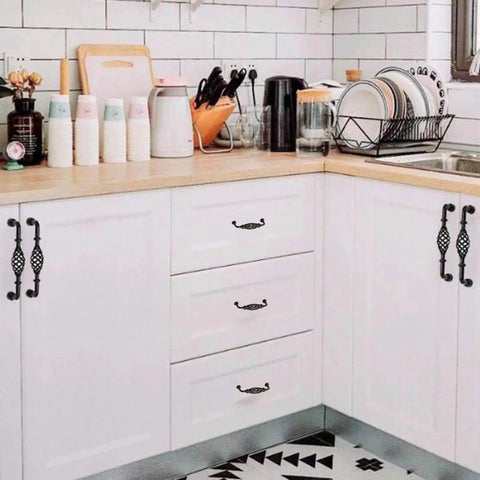 Four Pack Birdcage Style Cast Iron Antique Cabinet Hardware Handles With Center Hole Mount for kitchen cabinets in black finish.