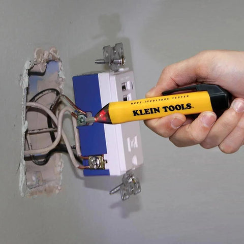 Hand using Klein Tools NCVT from Electrical Test Kit with Digital Multimeter, Non-Contact Voltage Tester and Electrical Outlet Tester