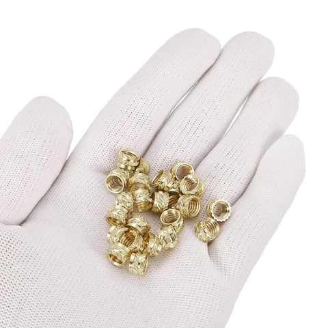 Knurled Insert Nuts, 25pcs M6 x 5mm L x 8mm OD 3D Printing Brass Nuts in a gloved hand, female threaded inserts.