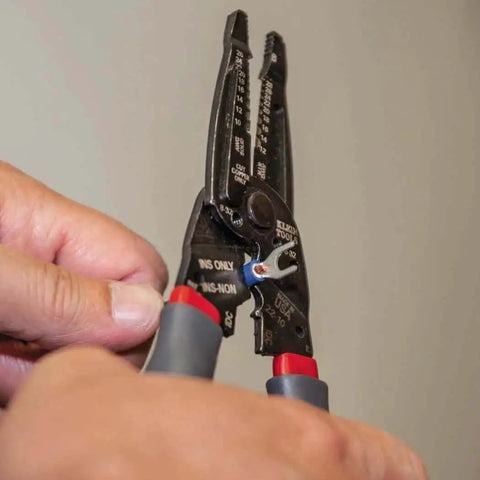 Hands using Kurve Wire Stripper Crimper Cutter Multi Tool for 10-26 AWG solid and 12-28 AWG stranded wire, reinforced head visible