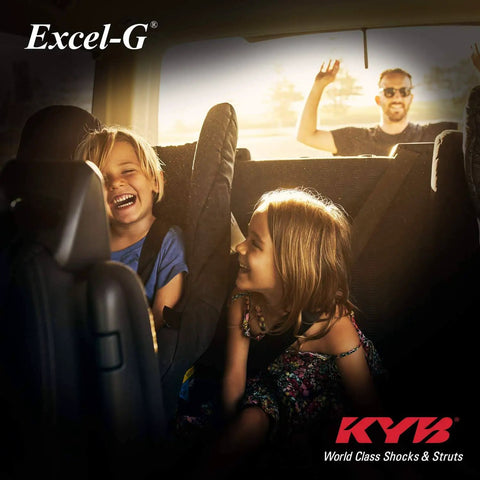 Children laughing inside minivan while man waves from outside, highlighting Excel-G Gas Shock Absorber Black for Asian Minivans OE Replacement for Honda Odyssey with Chrome Cylinder and Teflon Coated Piston Band to Restore Original Handling and Smooth Ride.