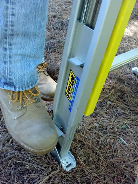 Close-up of Permanent Mount Ladder Levelers For Uneven Surfaces 2 Legs Complete Kit By Levelok in use, fits aluminum ladder.