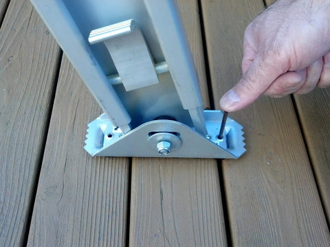 User adjusting Permanent Mount Ladder Levelers For Uneven Surfaces 2 Legs Complete Kit By Levelok, showing close-up of locking system.