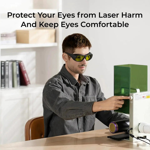 Person wearing Lightweight 50g Laser Safety Glasses For F1 F1 Ultra S1 M1 D1 Pro And D1 Lasers while working with laser equipment