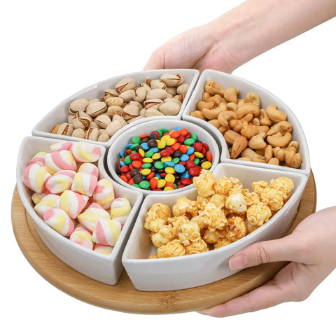 Divided Serving Dish Lazy Susan with 360 Degree Rotating Porcelain Tray on Bamboo Base and Five Removable Compartments filled with snacks