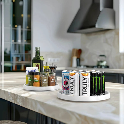 Four Pack Lazy Susan Spice Organizer Rotating Tray Set on kitchen counter with cans and spices, two 10-inch and two 12-inch trays shown.