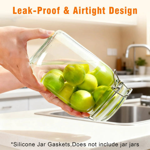 Kitchen glass canning jar with metal clasp, tilted, filled with green apples; white and orange silicone gaskets for lids.