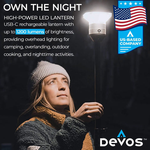 Outdoor LED Tripod Lantern With 1200 Lumens Adjustable 9 Foot Height Grab And Go Camping Light For Hiking Backyard And Emergencies Long Battery Life Rugged Aluminum Build Easy Setup shown being used by a person.