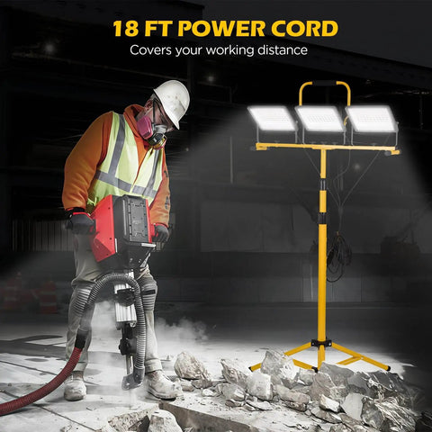 30000 Lumen LED Work Light With Stand, 3 Adjustable Head Waterproof Foldable Tripod next to construction worker, 18 ft cord, IP66 rated