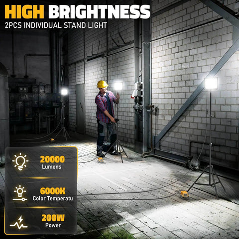 Massive 20000LM LED Work Lights With Stand For Dewalt Battery shown lighting a dimly lit industrial space, two tripod-mounted lights visible.