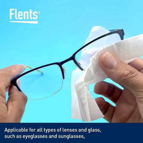 Person cleaning eyeglasses with Wipe N Clear Basic Lens Wipes 100 Count Individually Wrapped for Travel against blue background