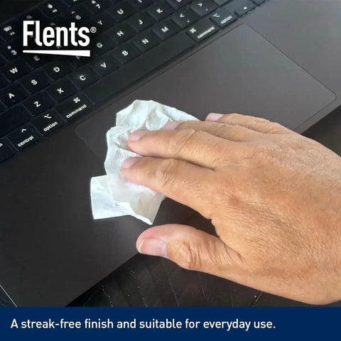 Hand using Wipe N Clear Basic Lens Wipes 100 Count Individually Wrapped for Travel to clean laptop keyboard