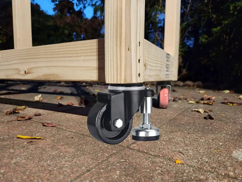 2 Inch Leveling Plate Caster Wheels With Adjustable Anti Vibration Leveling Feet on wood frame on outdoor concrete surface