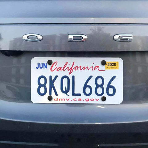 Rear view of a car with a license plate using ✝️ YALOK Anti Theft License Plate Screws Kits- Rustproof Stainless Steel Car Tag Plate Mounting Hardware installed.