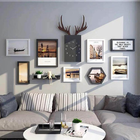 Living room wall with various framed art and clock decor using Transparent Double Sided Adhesive Tape 1/2 Inch By 10 Feet, Acrylic.