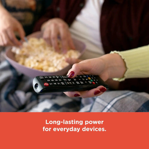 Couple watching TV with remote powered by Mixed Alkaline Battery Pack 12 AA 12 AAA With Reusable Plastic Case