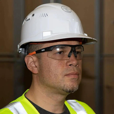 Man wearing Low Profile Safety Glasses Narrow Lens Z87 1 Anti Fog Scratch Resistant 2 Pack, in safety gear.
