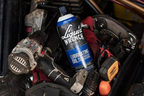 Heavy Duty Lubricating Oil For Tools And Machinery 11 Oz Keeps Moving Parts Slick Quiet And Rust Free Perfect For Hinges Chains Sprockets Locks And Small Engines A Trusted Workhorse From Liquid Wrench in a toolbox with various tools