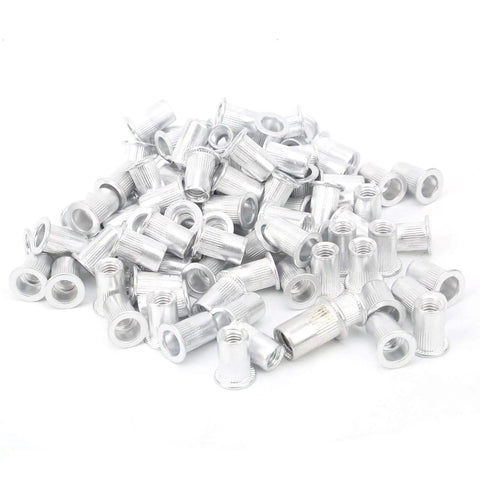 Pile of 100 piece aluminum pull rivet nuts set flat head M6 for metal plates and pipe fastening with organized plastic box visible on surface