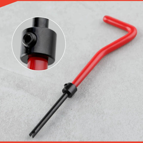 Close-up of red and black installation spanner from M6 Thread Repair Kit With Helicoil Inserts And HSS Drill Taps For Auto Repair Rethreading.