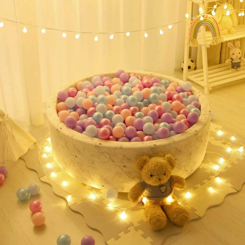 Ball Pit Balls - 100pcs - Crush Proof Plastic Children's Toy Balls Macaron Ocean Balls in a round play area with teddy bear