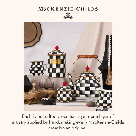 Mackenzie-Childs ceramic kitchenware set with black and white courtly check pattern, teapot, cups, and canisters on a table