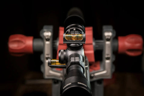 Close-up view of Magnetic Base Scope Leveling Tool for Gunsmithing and Maintenance by Wheeler Engineering mounted on a rifle scope.