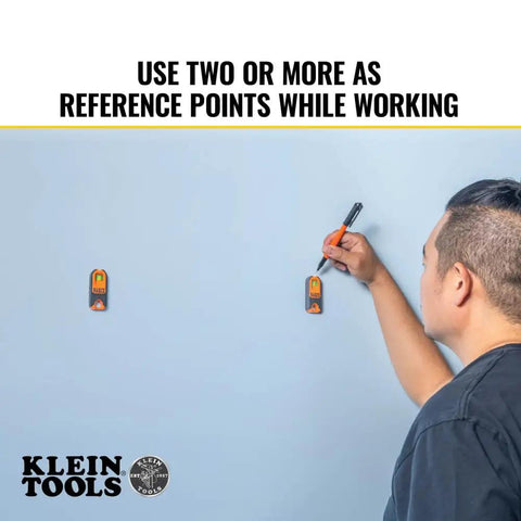 Person using Compact Magnetic Stud Finder And Level With Bubble Vial For Wood And Metal Detection Rare Earth Magnet on wall