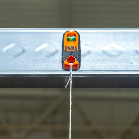 Compact Magnetic Stud Finder And Level With Bubble Vial for Wood and Metal Detection in use on metal frame