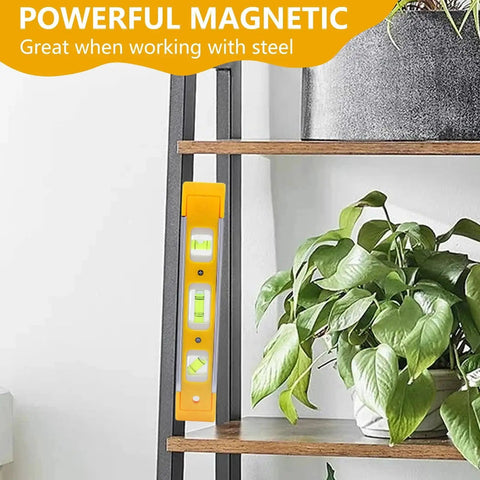Magnetic 9 Inch Torpedo Level with three vials at 45, 90, and 180 degrees attached to a metal shelf for hands-free use.