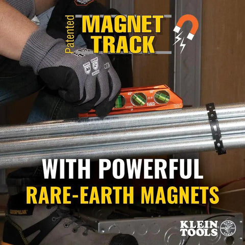 Compact 6-Inch magnetic torpedo level with a V-groove for conduit work delivers hands-free stability, shown on metal pipes