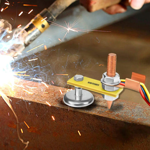 Fix Tite Magnetic Welding Ground Clamp with strong suction head and copper tail stabilizer in use on metal surface during welding.