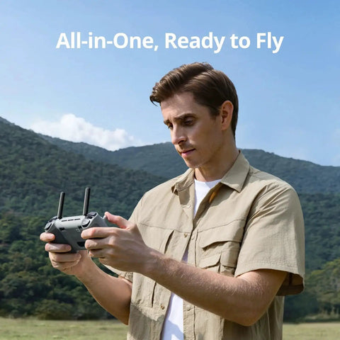 Man using PTD 1 Remote Controller With 5.5-Inch 1080P Full HD Touch Display 10KM Transmission 6400 mAh Battery outdoors.
