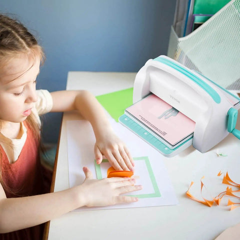 Child using the All In One Die Cutting And Embossing Machine For Scrapbooking And Card Making 9 Inch A4 Opening Manual Starter Kit By VEVOR